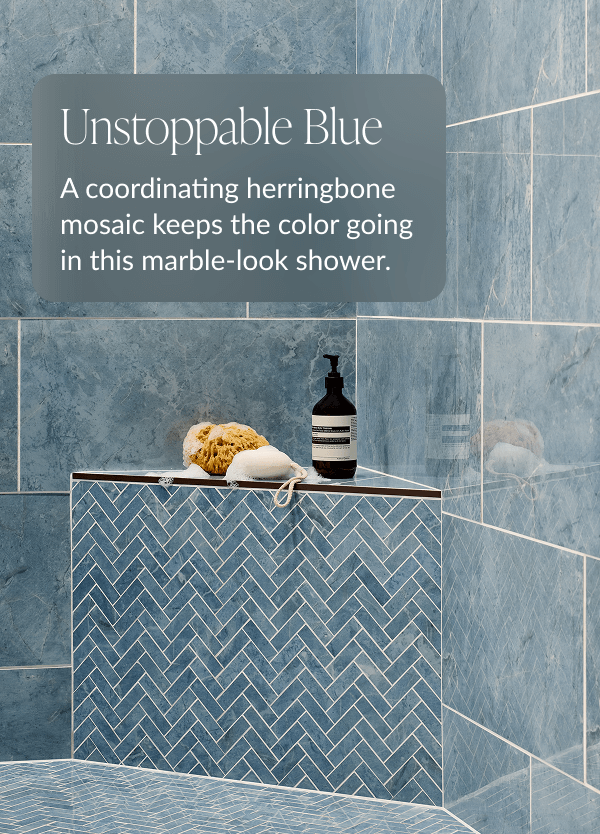Unstoppable Blue - A coordinating herringbone mosaic keeps the color going in this marble-look shower. 