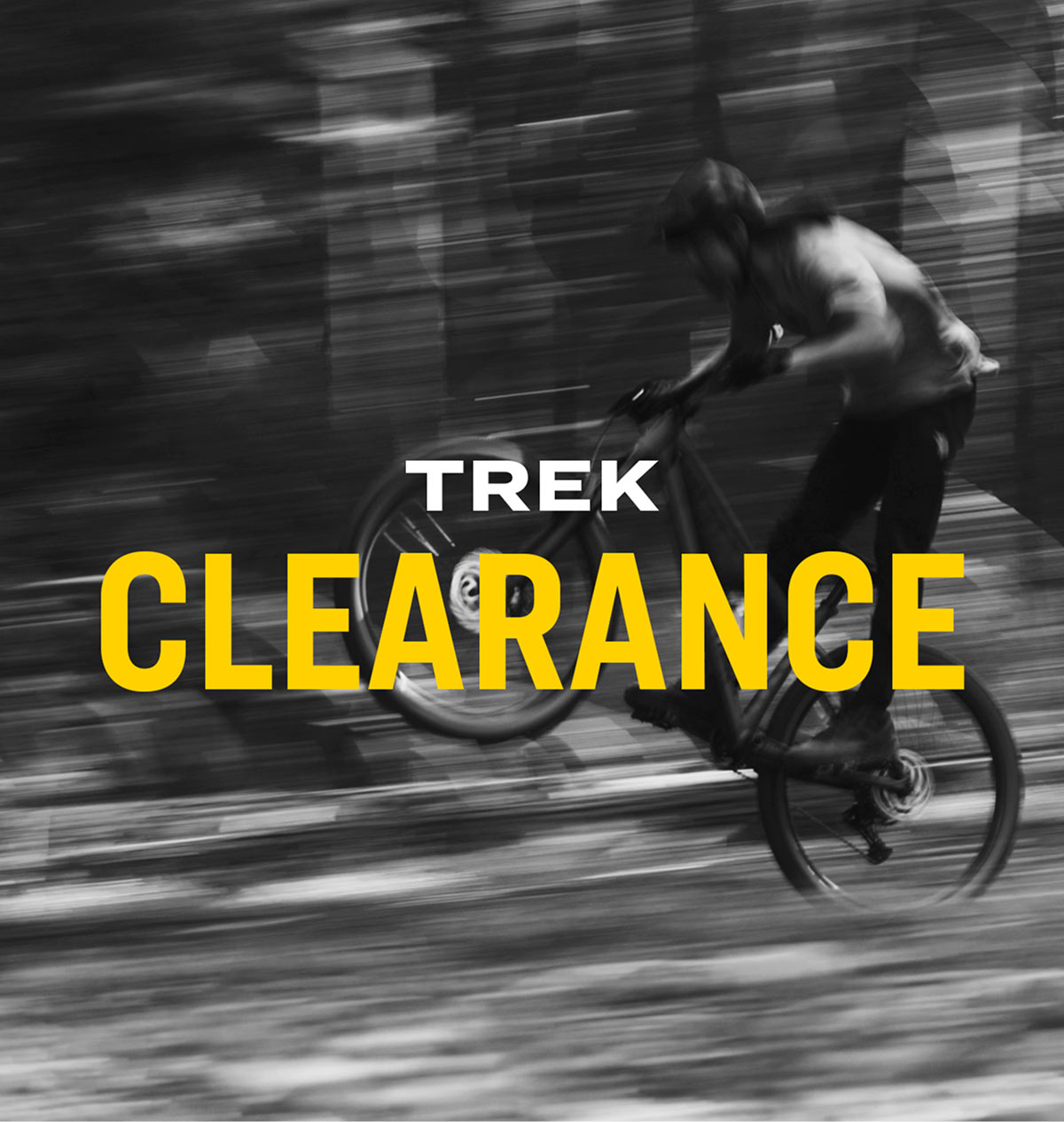 The words, 'TREK CLEARANCE' overlaying black and white photo of cyclist wearing helmet while riding bike outside