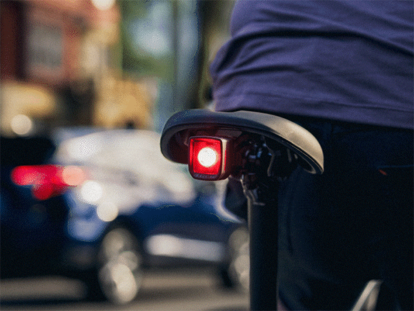 Animated photo of flashing daytime running light mounted underneath saddle on bike