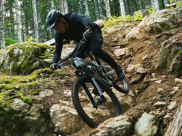 A person rides a mountain bike in motion blur