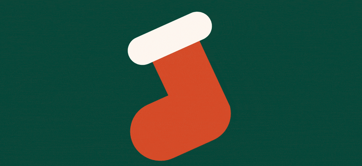 Slideshow of holiday illustrations such as a red holiday hat, white snowflake, green fir tree, and a round red and white striped peppermint