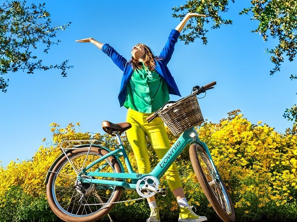 Rider enjoying a neighborhood ride on a Townie Go! e-bike
