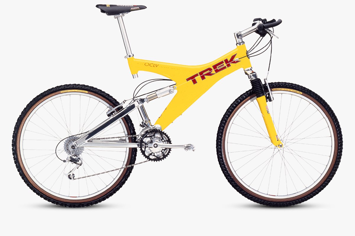 Yellow Trek mountain bike on a white background