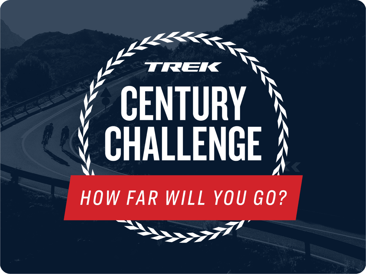 Trek Century Challenge logo with the words, 'How far will you go?' overlaying black and white image of cyclists wearing helmets while riding bikes on paved road with trees and mountains in background