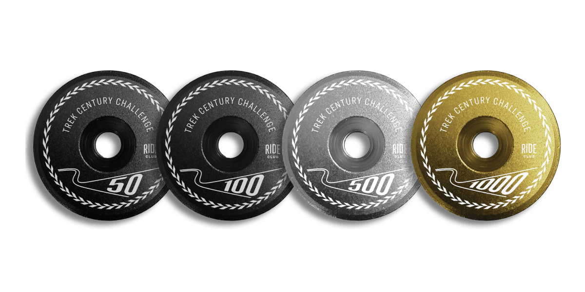 Four limited-edition Trek Century Challenge stem caps for the 50, 100, 500, and 1,000 mile distances