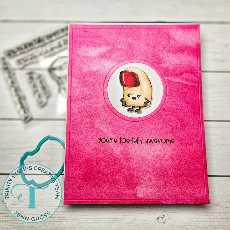 Greeting card in pink tones featuring a painted red toe nail on a big toe