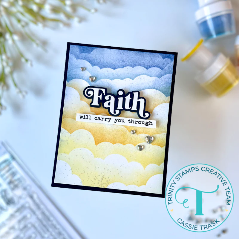 Greeting card featuring blue and yellow cloudy sky with "Faith will carry you through" message on front