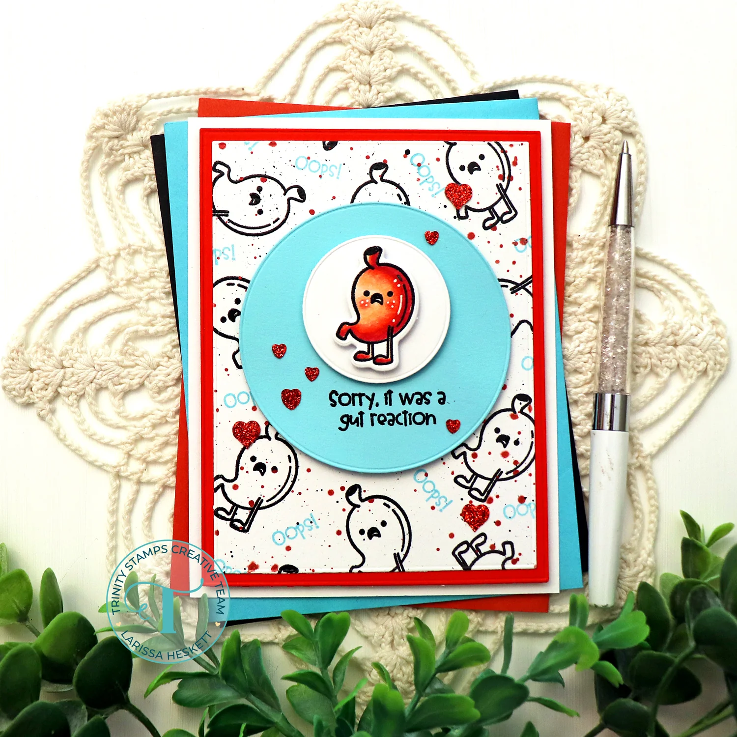 Black, red, white, and blue greeting card with a stomach character and the phrase "sorry, it was a gut reaction"