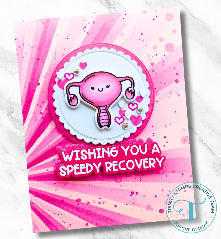 Cute smiling uterus on scalloped white circle with a background of pink tones. Message reads, "Wishing you a speedy recovery."