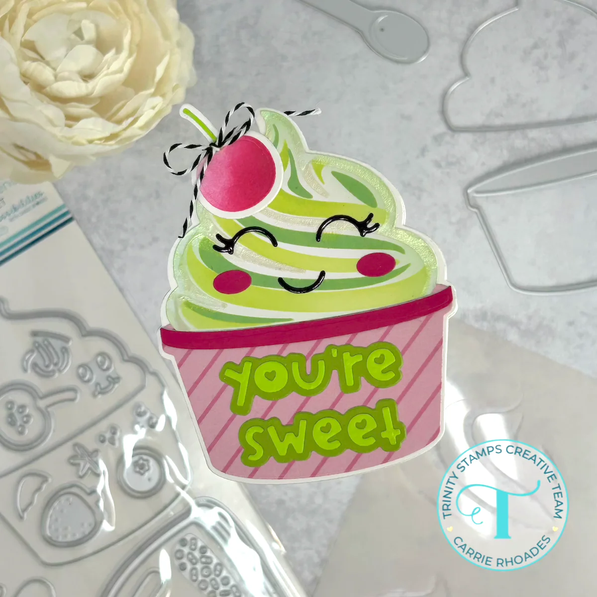 Lime green frozen-yogurt shaped card with a cherry on top in a pink striped cup. Message reads "you're sweet" in green.