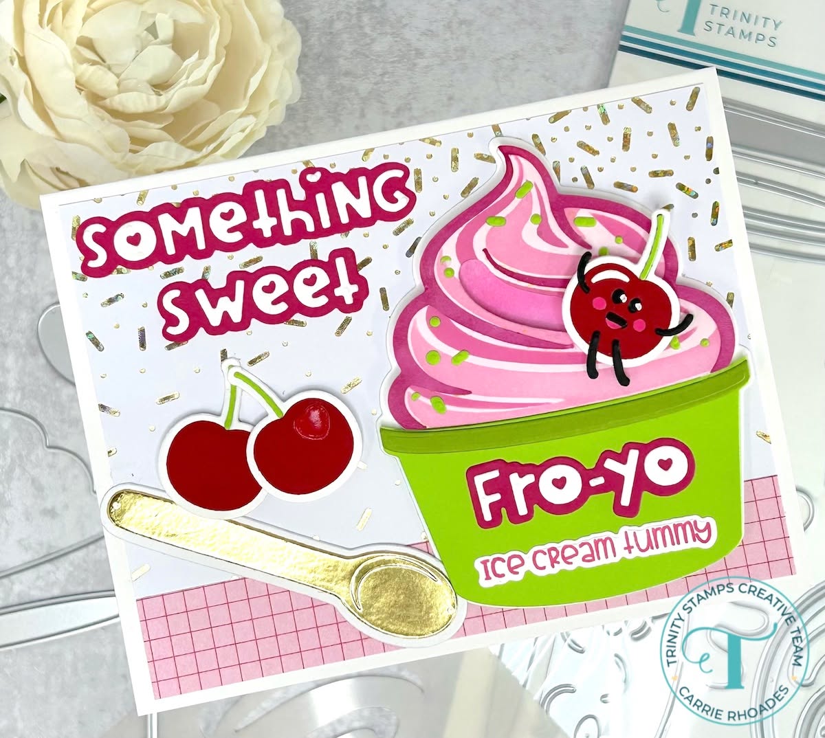 Pink frozen yogurt in green cup on sprinkles background with interactive sliding cherry element. Message reads "something sweet fro-yo ice cream tummy"