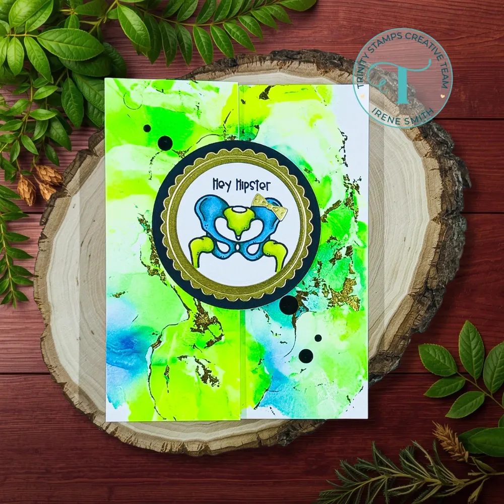 Lime green and electric blue Hipster stamp on gold and black circle with alcohol ink background
