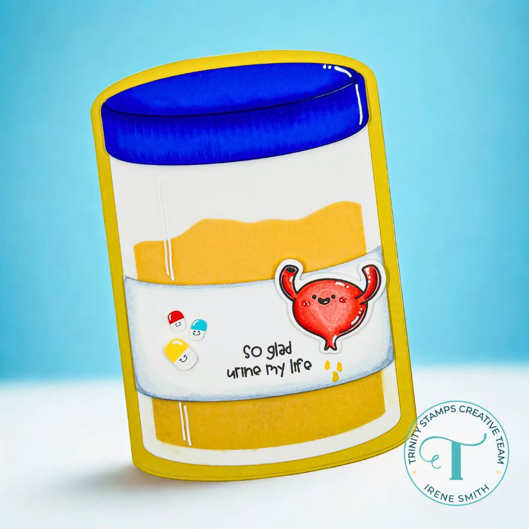 Comical pill bottle-shaped card die emulating a medical sample in yellow with a blue lid and featuring a colored bladder and the message "so glad urine my life"
