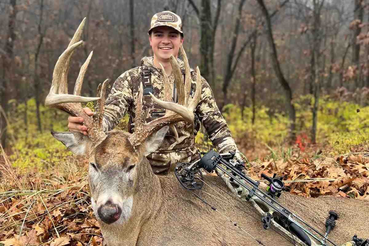 Hunter standing proudly behind kill