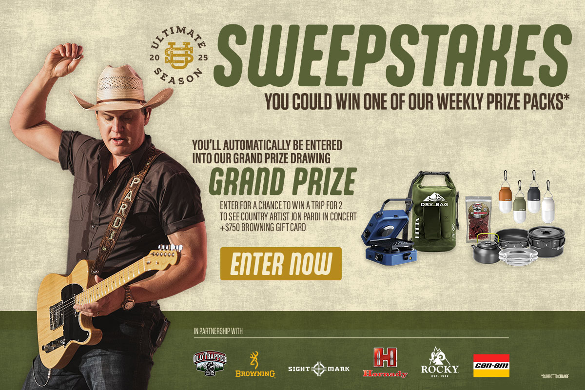 Country musician playing guitar next to sweepstakes prizes