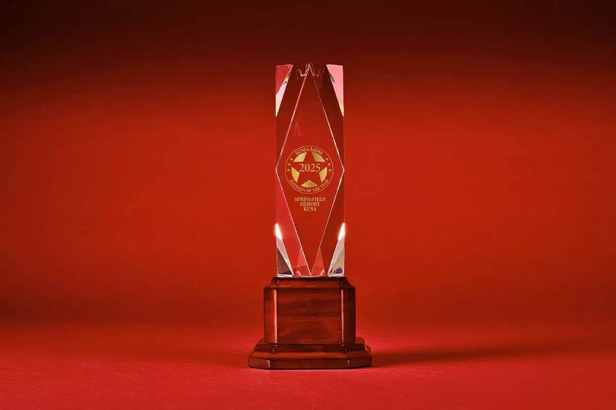 Crystal clear, sleek, glass trophy on red background