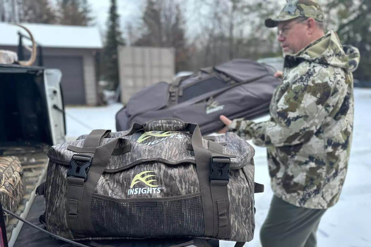 Hunter loading back of truck