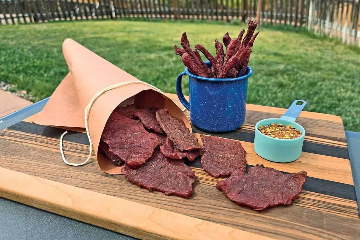 Jerky displayed on wooden cutting board