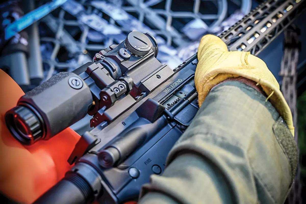 Close-up of gloved hand holding AR-15
