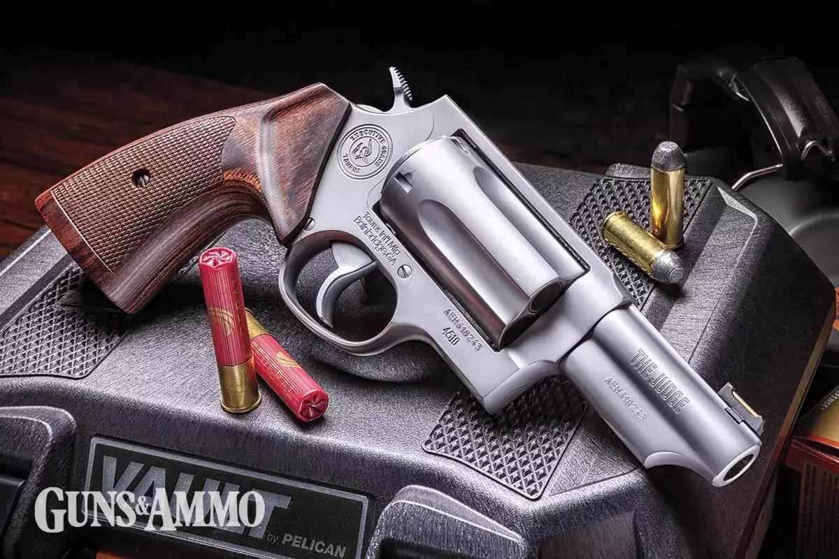 Wooden handled revolver on black gun case with ammunition beside it