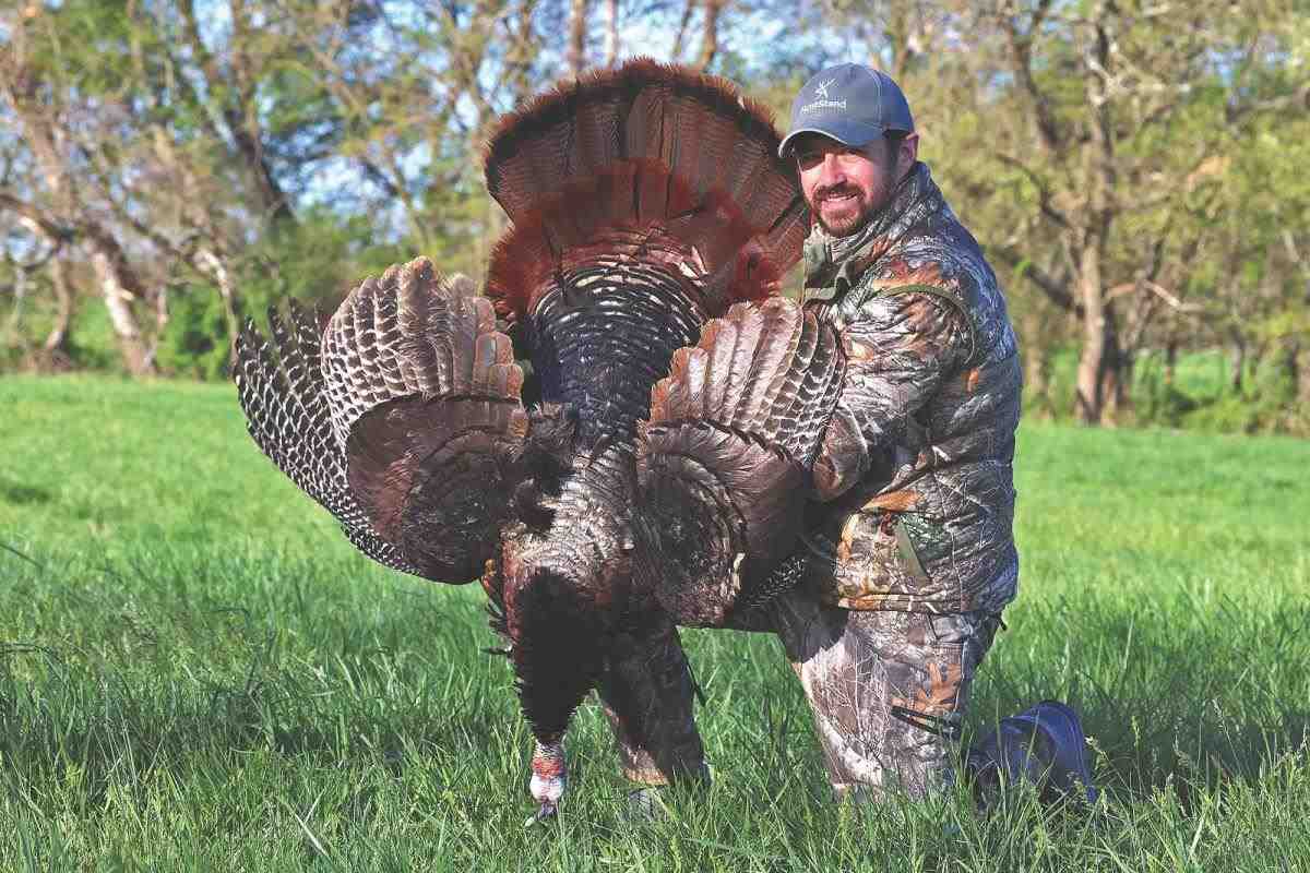 Hunter holding turkey
