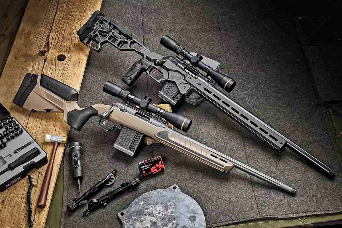 Multiple rifles displayed on a fiber background