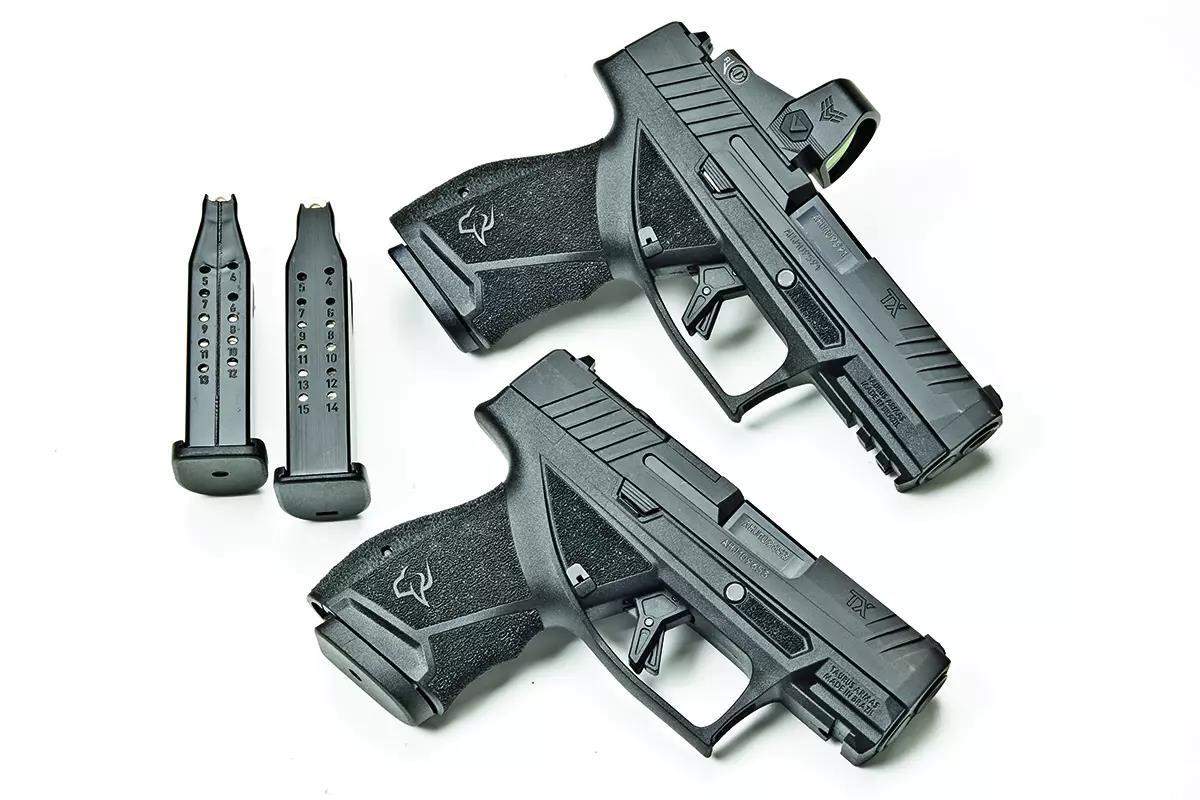 2 black Taurus handguns with 2 magazines beside them