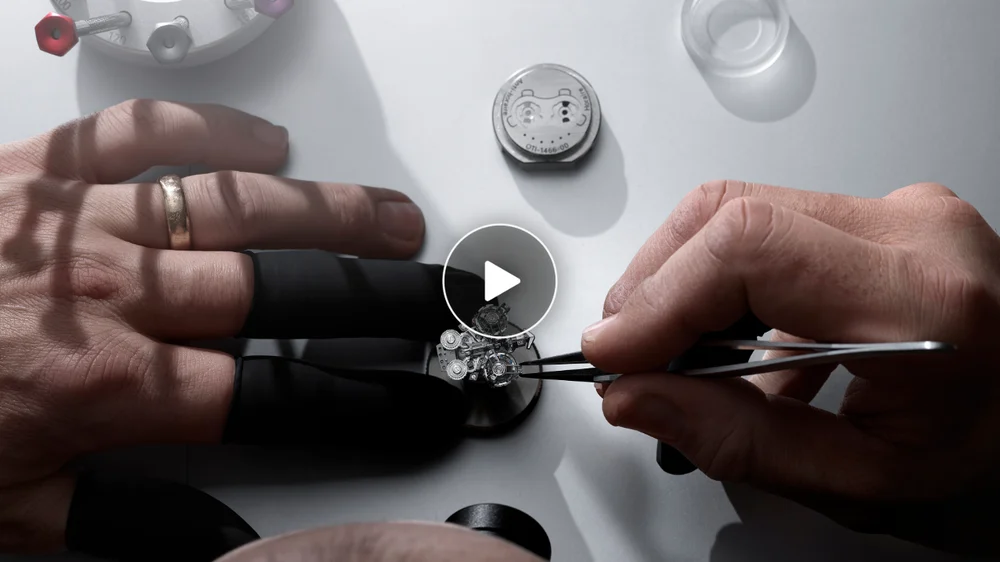 Image of a watchmaker working on the Super Freak