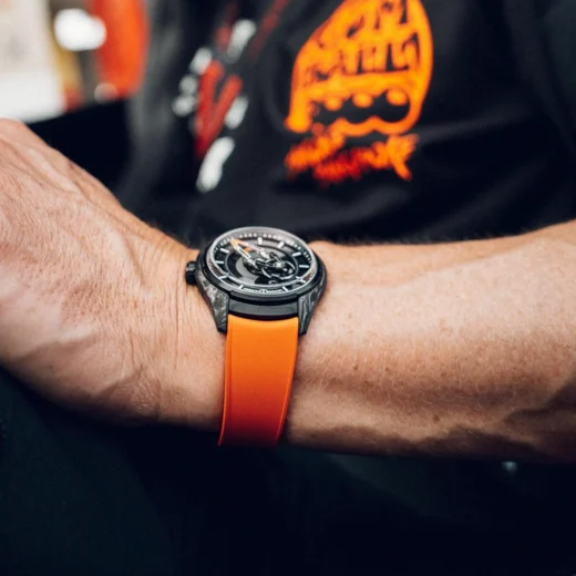 Driver wearing Freak X Gumball 3000 at the wheel