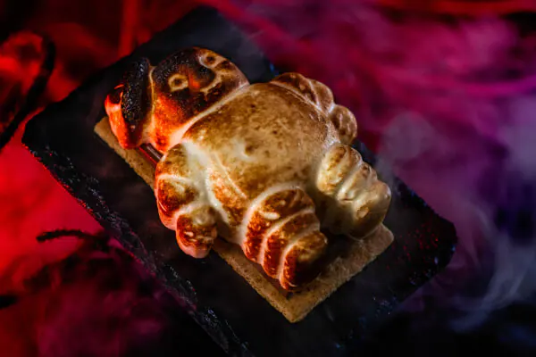 Toasted marshmallow shaped like a Mini-Puft served atop a chocolate bar and graham cracker.