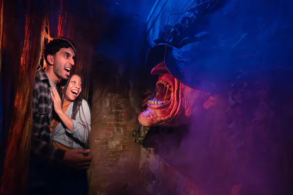 Image of Couple surprised by monster.