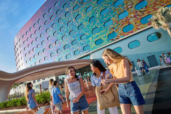 People&nbsp;walking&nbsp;near&nbsp;the&nbsp;front&nbsp;entrance&nbsp;of&nbsp;Universal&nbsp;Terra&nbsp;Luna&nbsp;Resort.