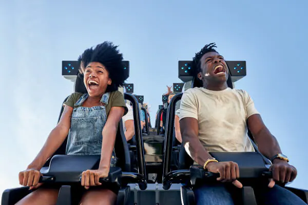 Couple screaming while riding in the very front of the Velocicoaster in the Jurassic Park area at Universal’s Islands of Adventure