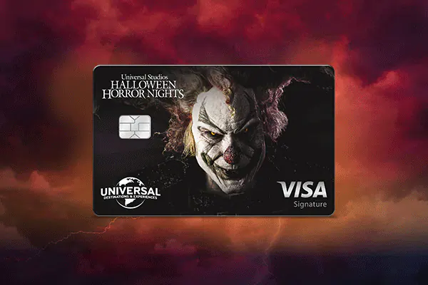 A four image rotating gif of the Universal Rewards Visa Signature® Card with Universal Studios Halloween Horror Nights designs on the card, with fog and lightning in the background with a red hue.