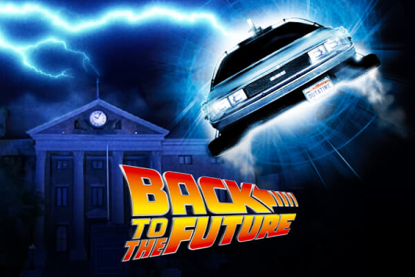 The Back to the Future logo in front of a lightning bolt striking the clock tower and the Time Machine flying towards camera.