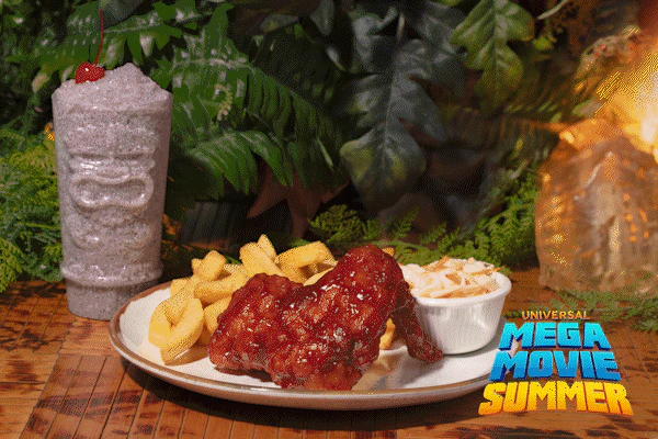 Universal Mega Movie Summer logo over three rotating themed dishes: Jurassic smoked turkey wing and fries, JAWS funnel cake with fin, and Back to the Future white-and-blue milkshake.