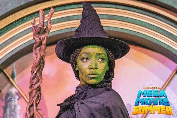 A gif of the Mega Movie Summer logo and performers dressed as Elphaba and Glinda from Wicked at Universal Studios Hollywood.