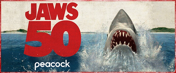 Illustration of a shark emerging from the water and text “JAWS 50” with Peacock logo below.