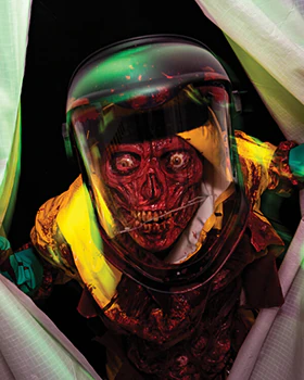 A scareactor with a feather growing out of its insect head, glowing red bug eyes, and multiple rows of sharp teeth.