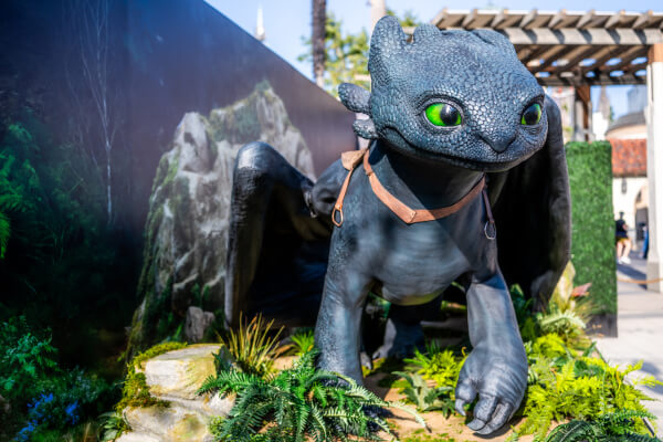 Toothless standing on top of a boulder at Universal Studios Hollywood.