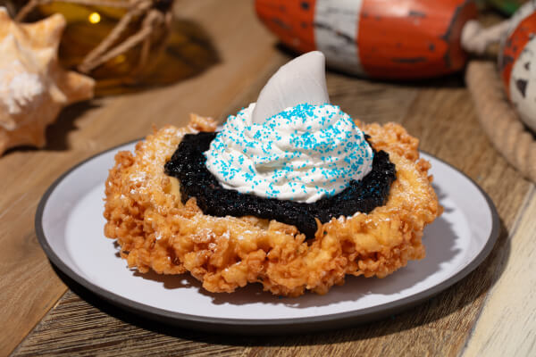 A Jaws themed Funnel Cake with a shark fin on top, available at Universal Studios Hollywood.