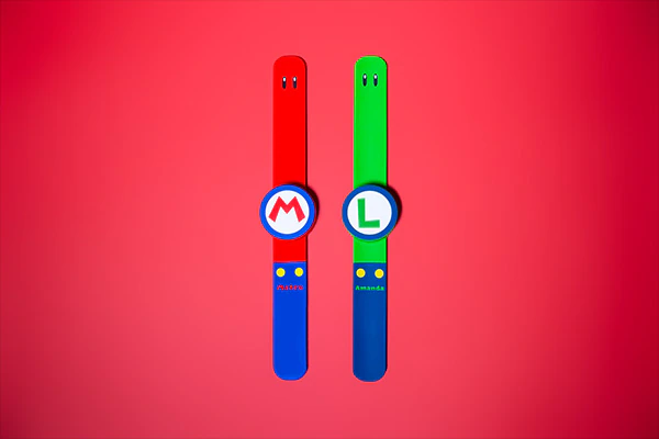 One red and one green Power-Up Band from SUPER NINTENDO WORLD.