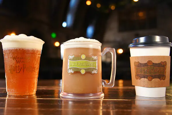 A cold Butterbeer, a frozen Butterbeer and a hot Butterbeer on a table at the Wizarding World of Harry Potter™.