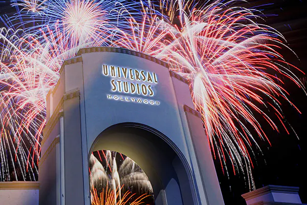 4th of July Celebration with fireworks illuminating the iconic arch at Universal Studios Hollywood.