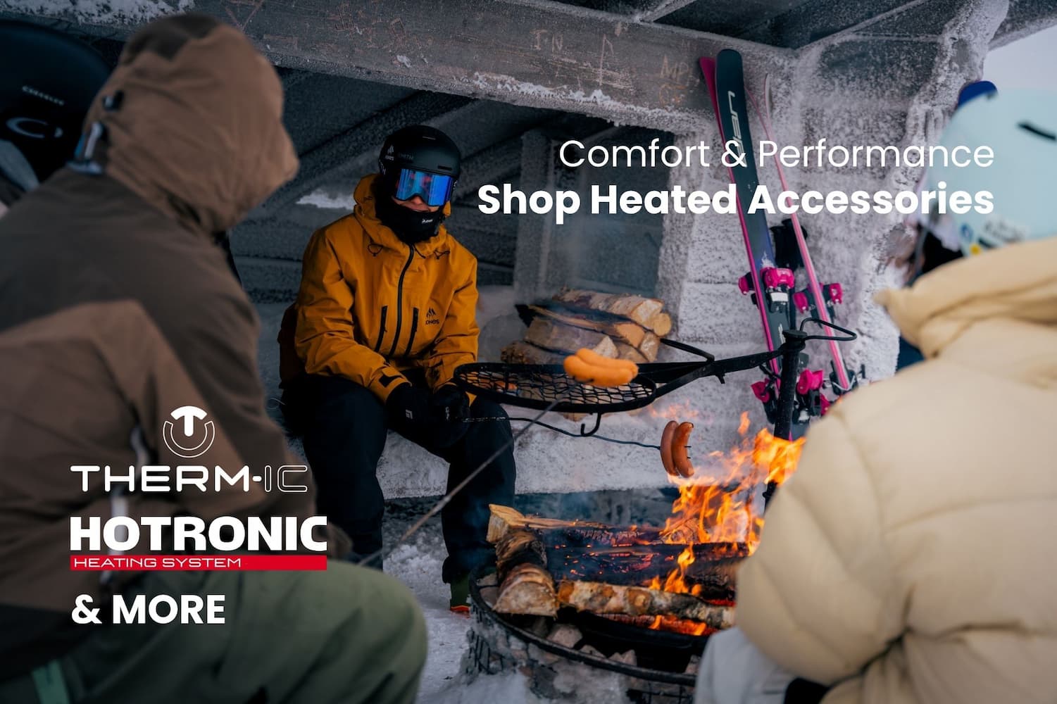 text "comfort and performance- shop heated accessories from hotronic, thermic, and more" over an image of a woman carving on skis