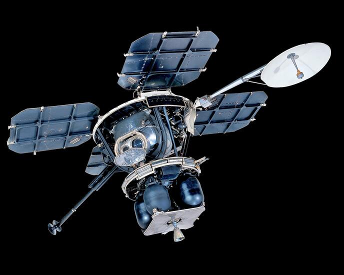 Lunar Orbiter photographed against a black background.