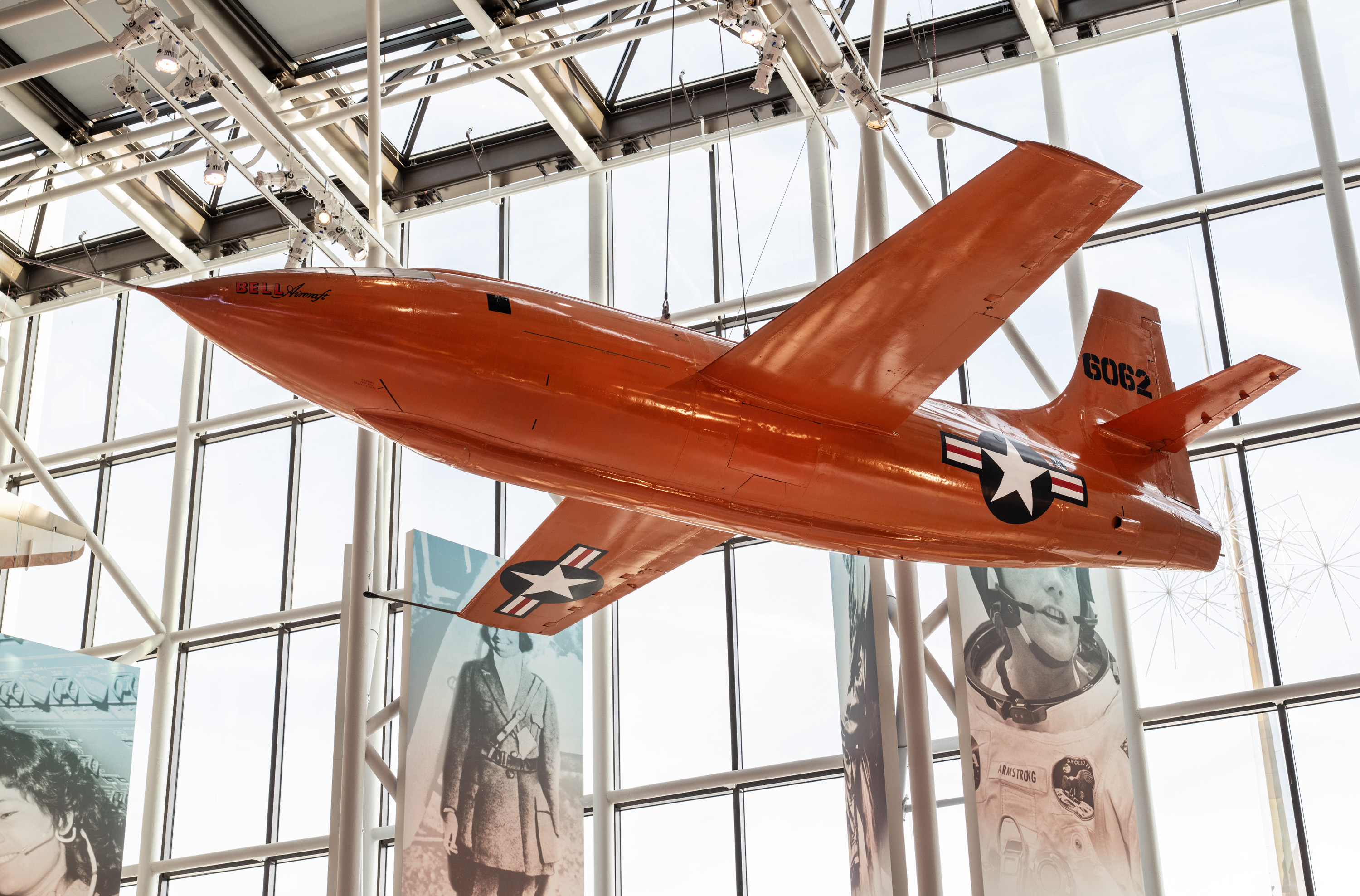 Bright orange Bell X-1 hanging in the gallery.