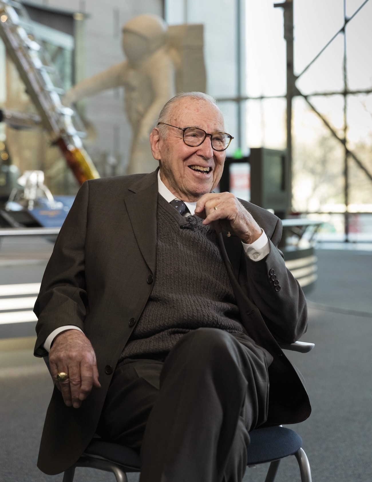 Jim Lovell in the museum as an older man.