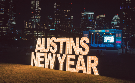 A brightly lit sign advertising Austin's New Year celebration in Austin, Texas