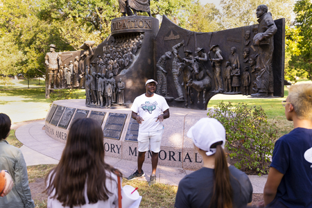 A tour guide discussing Black history in Austin, Texas